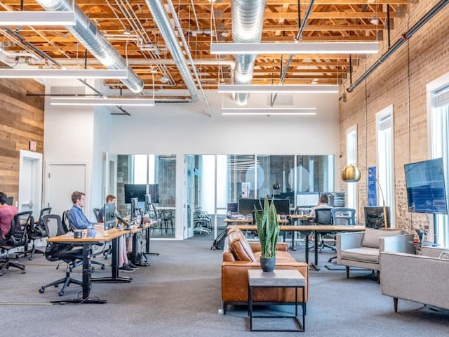 Agency team collaborating on multiple client projects in Unshift, showing the drag and drop editor with a client website